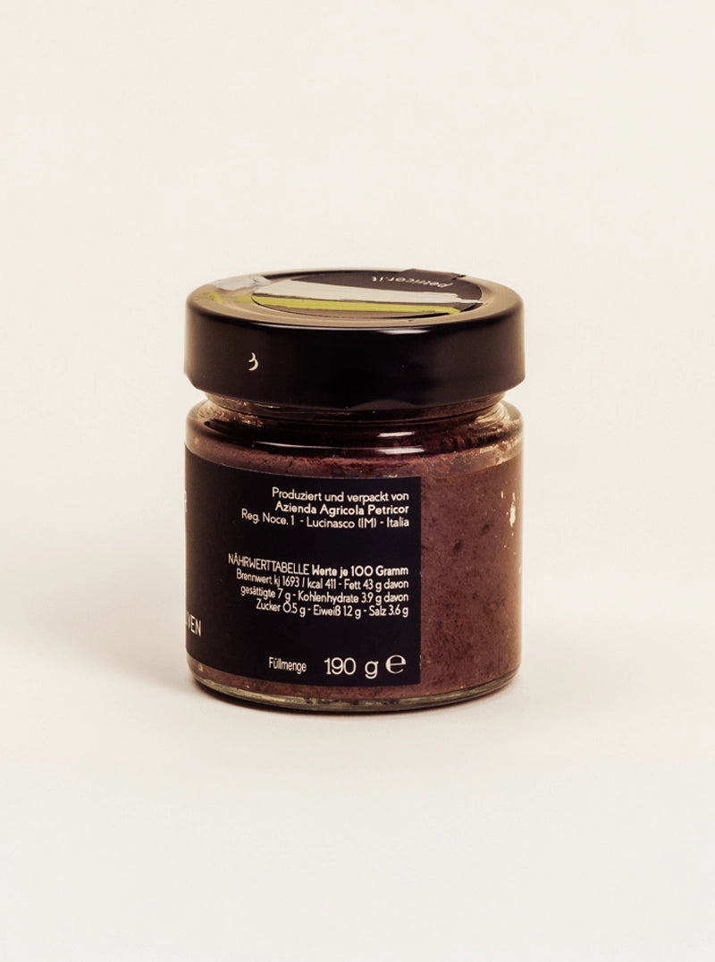 Ein Glas Petricor Olivenpaste von hinten